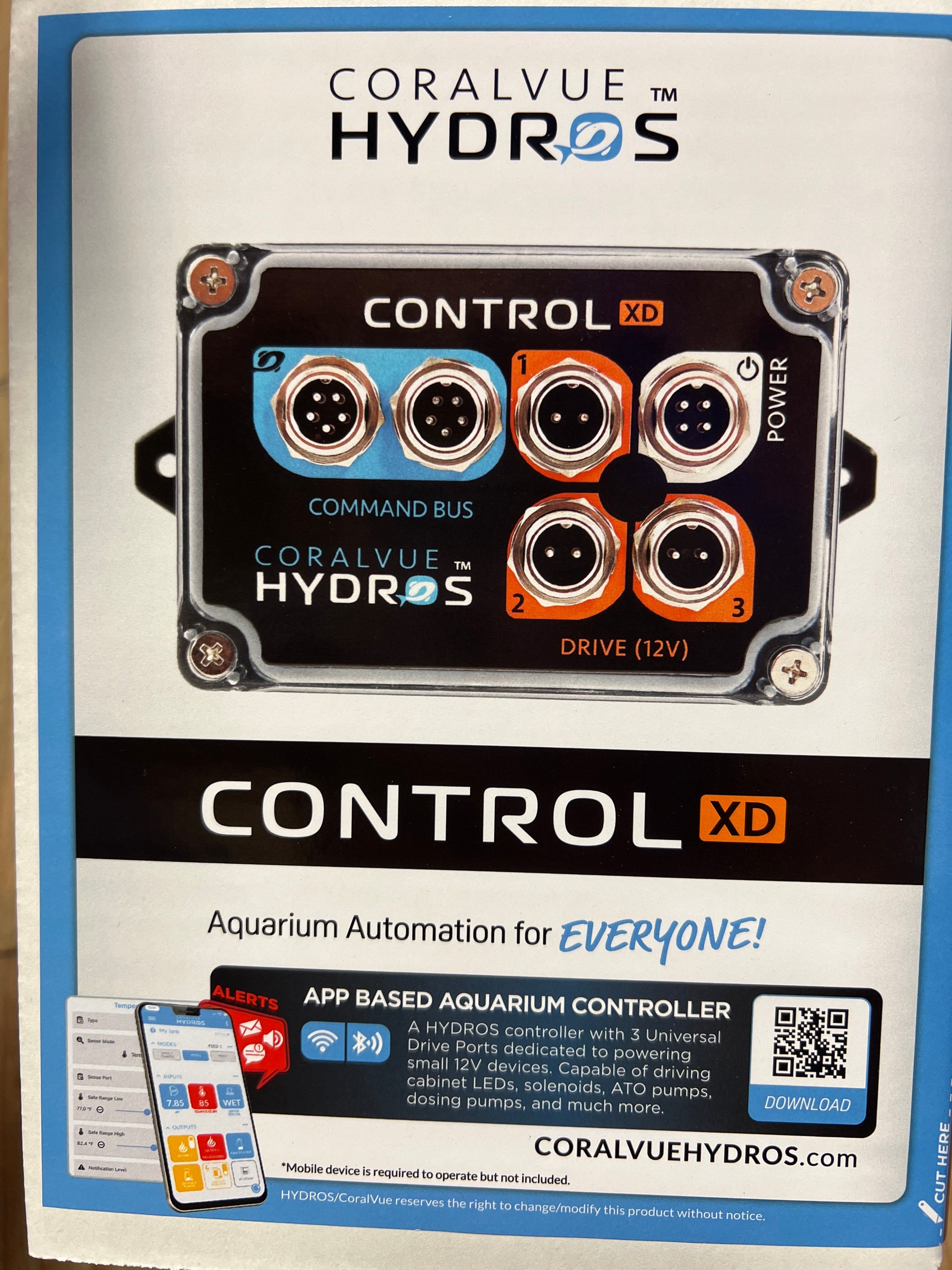 Packaging for CoralVue Hydros Control XD, an aquarium automation controller with a black, blue, and orange design featuring multiple control buttons and a QR code.