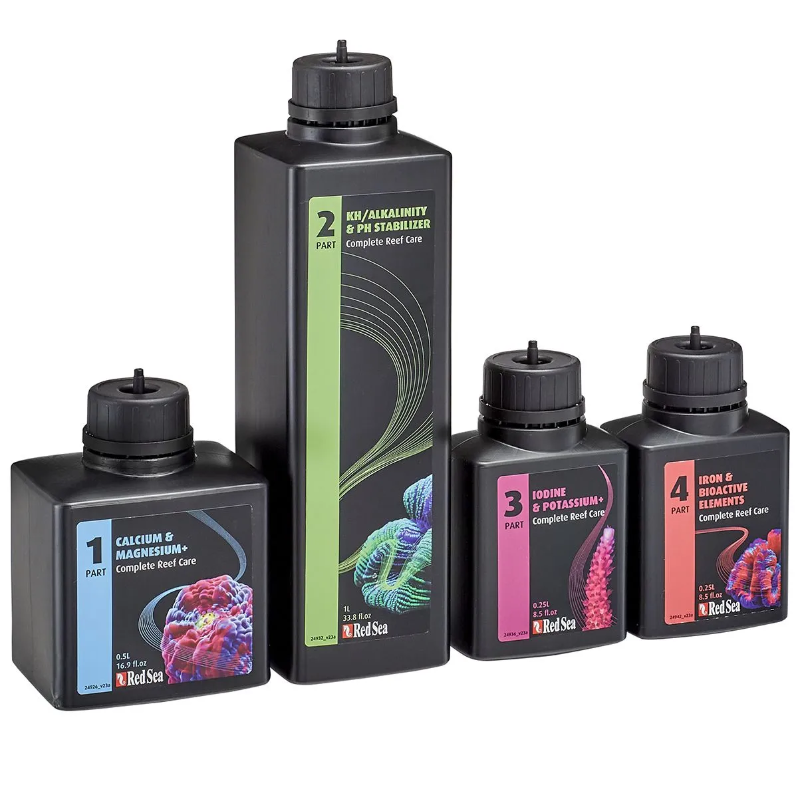 Set of aquarium water treatment bottles with labels on a white background