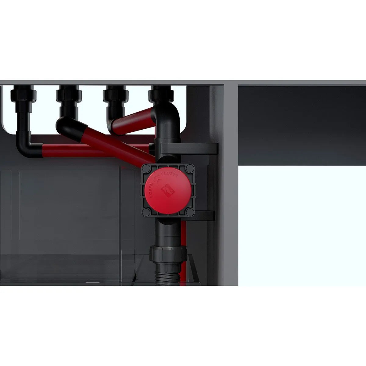 close up of the drain plumbing with a red and black silencer valve
