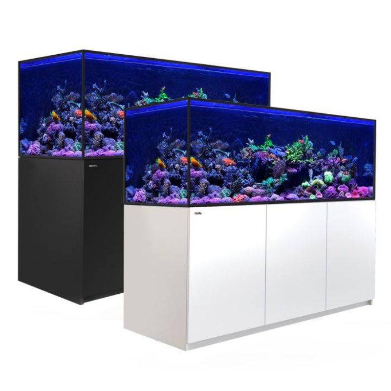 red sea reefer 850 aquarium with lack stand behind an aquarium with a white stand on a white background