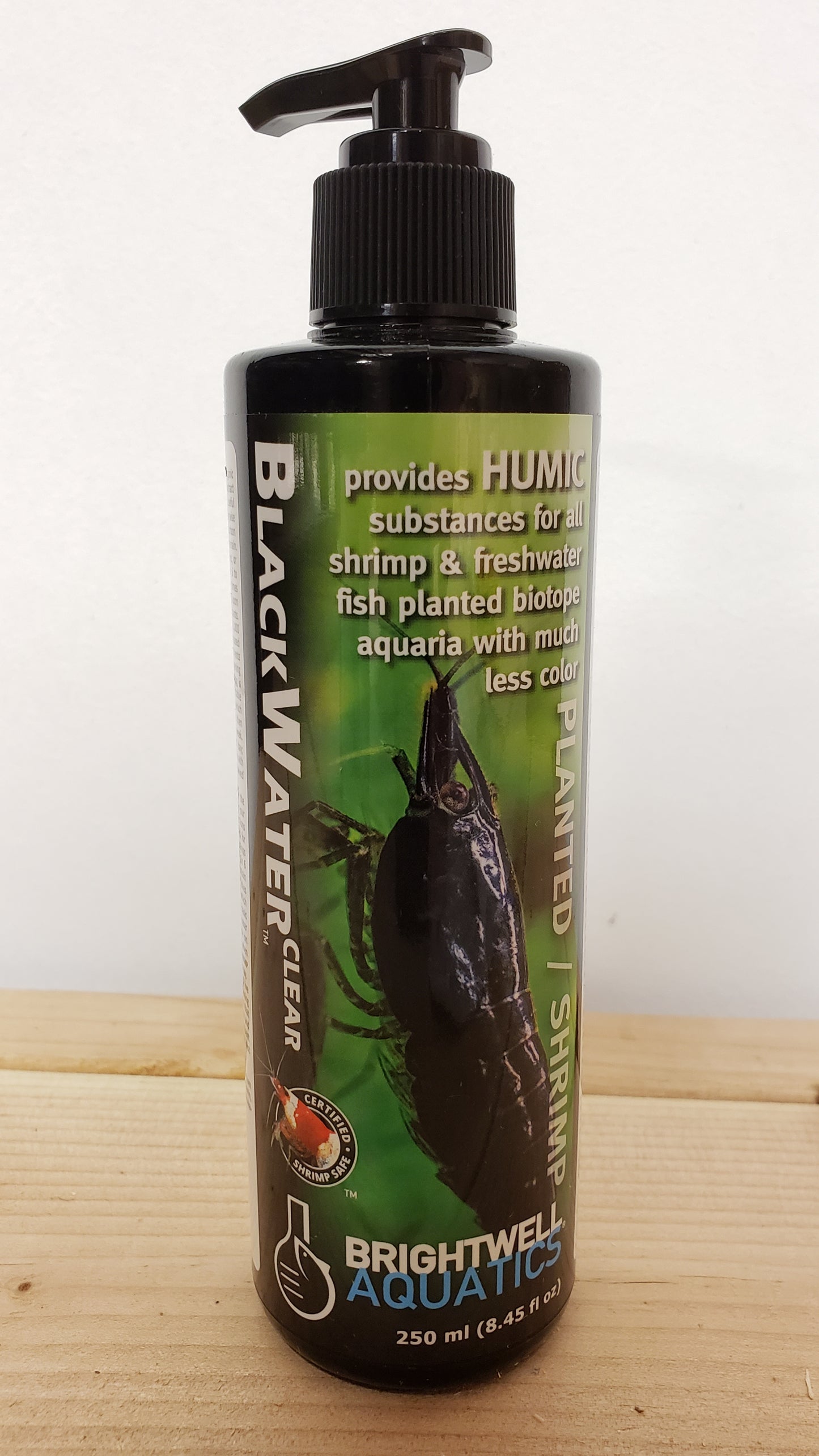 A bottle of Brightwell BlackWater Clear aquarium water treatment, 250ml with a spray nozzle.