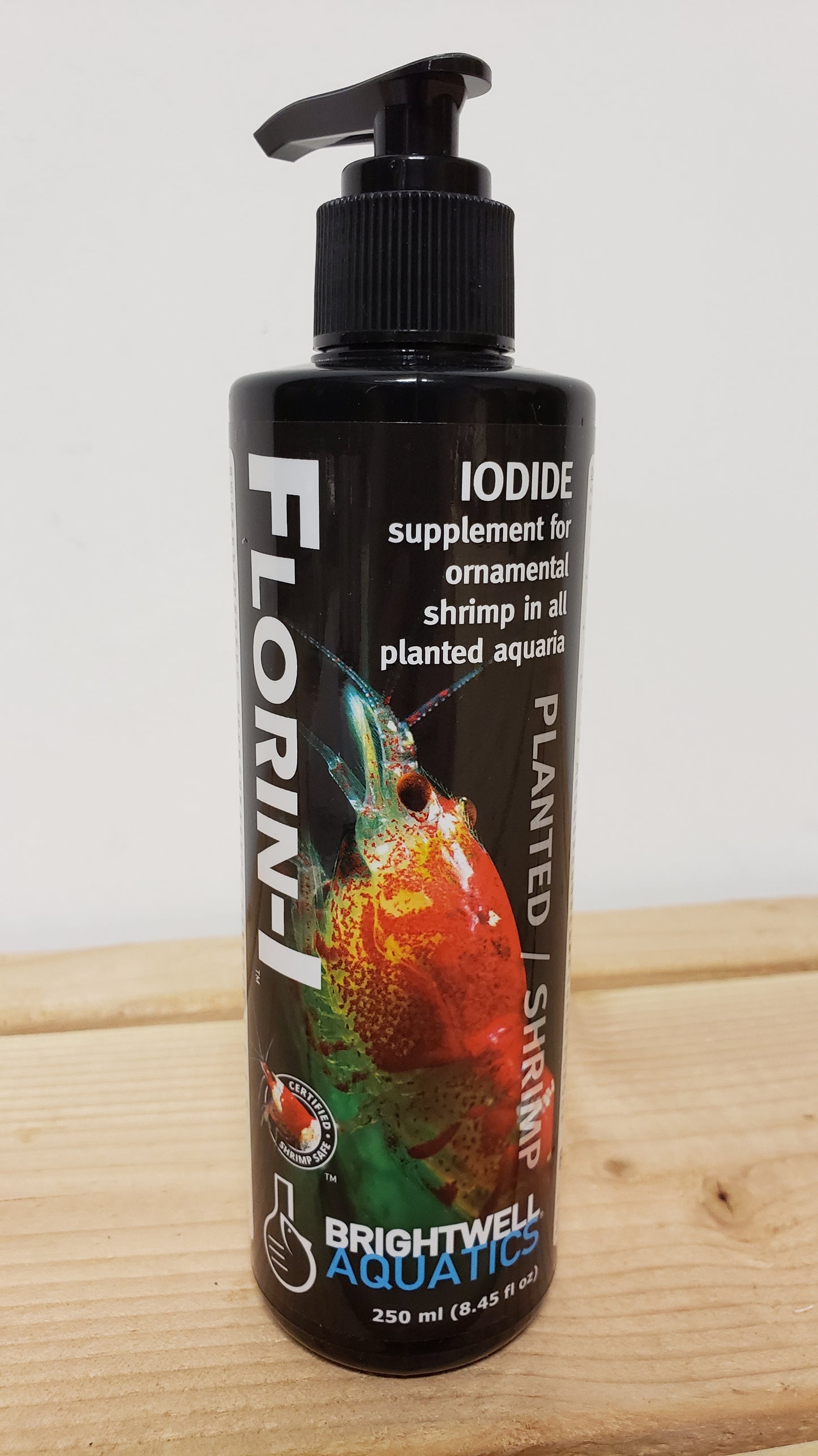 A bottle of Brightwell Florin-I Iodine, a supplement for marine aquariums, with branding and product information on the label.