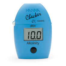 Handheld blue colorimeter with digital display showing the alkalinity level in dKH units.