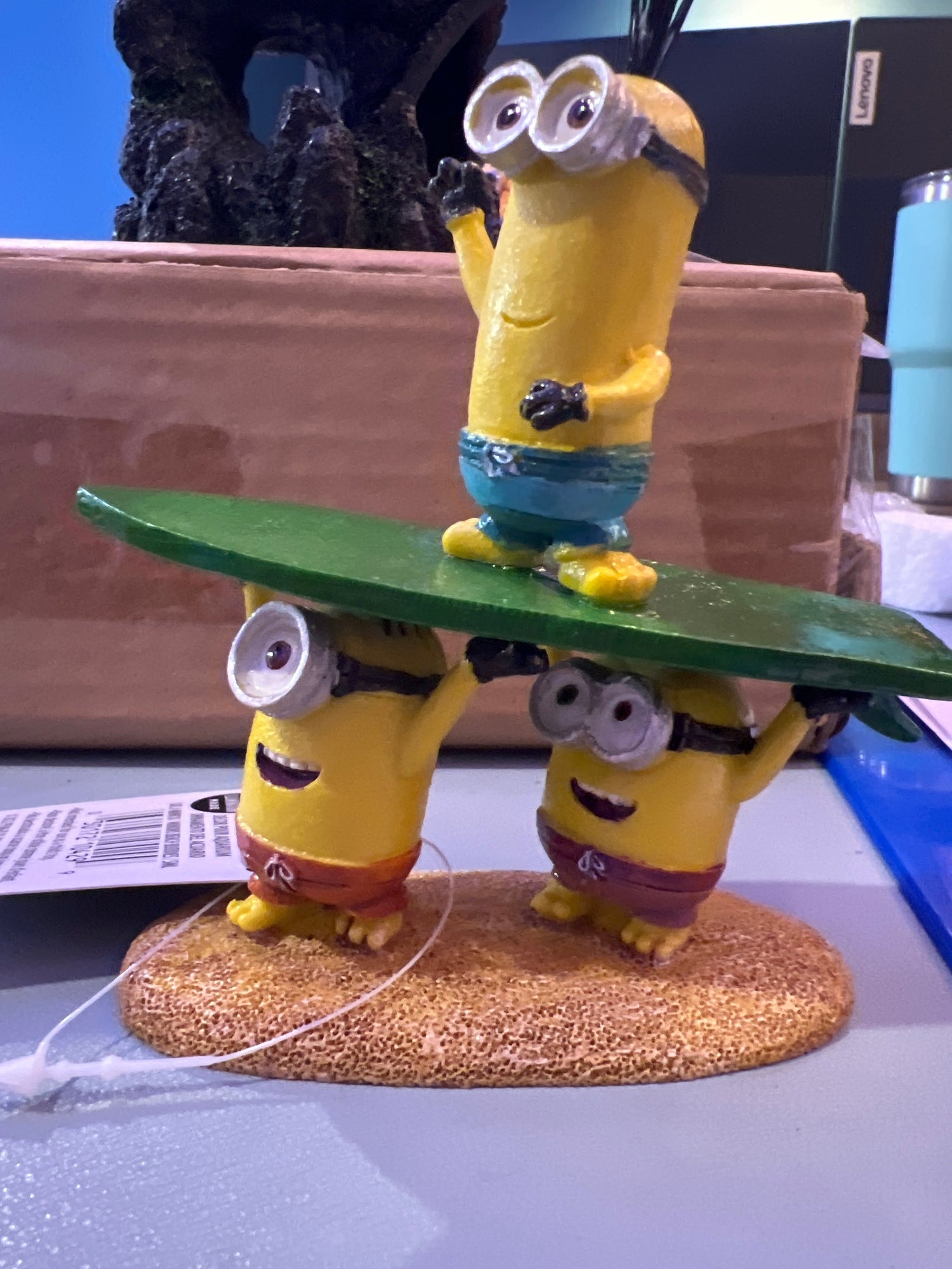 Aquarium Decorations showing Minions standing on surf board