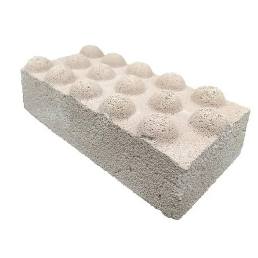 Rectangular block with embedded spherical objects on a white background