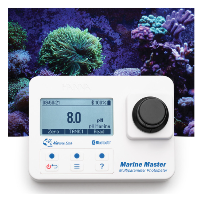 Marine Master multiparameter photometer with digital display against a coral reef background