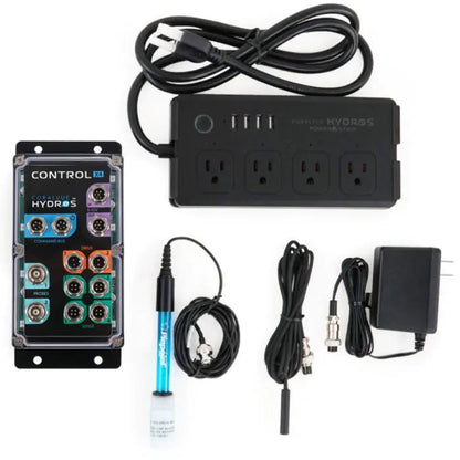 Collection of electronic components including a power strip, control panel, and cables on a white background.
