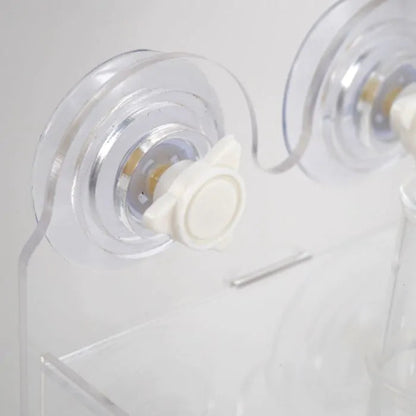 Close-up of a clear plastic product with a white component on a light gray background