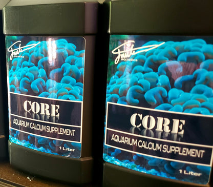 Two bottles of CORE aquarium calcium supplement by Fauth Aquatics, each containing 1 liter of the solution, with a label showing a close-up image of blue coral.