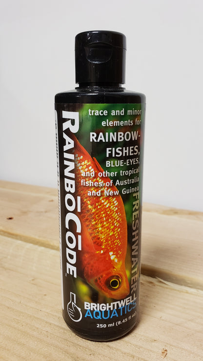 This image features a 250ml bottle of Brightwell Rainbo Code, a specialized aquatic product designed for trace and minor element correction in rainbow fish and other tropical fish. The bottle is prominently labeled with the product name and has a vivid image of a rainbow fish on it, emphasizing its use and target species.