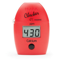 Handheld red colorimeter with digital display showing calcium levels in ppm.